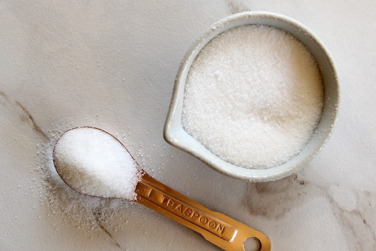 Cup and teaspoon of sugar