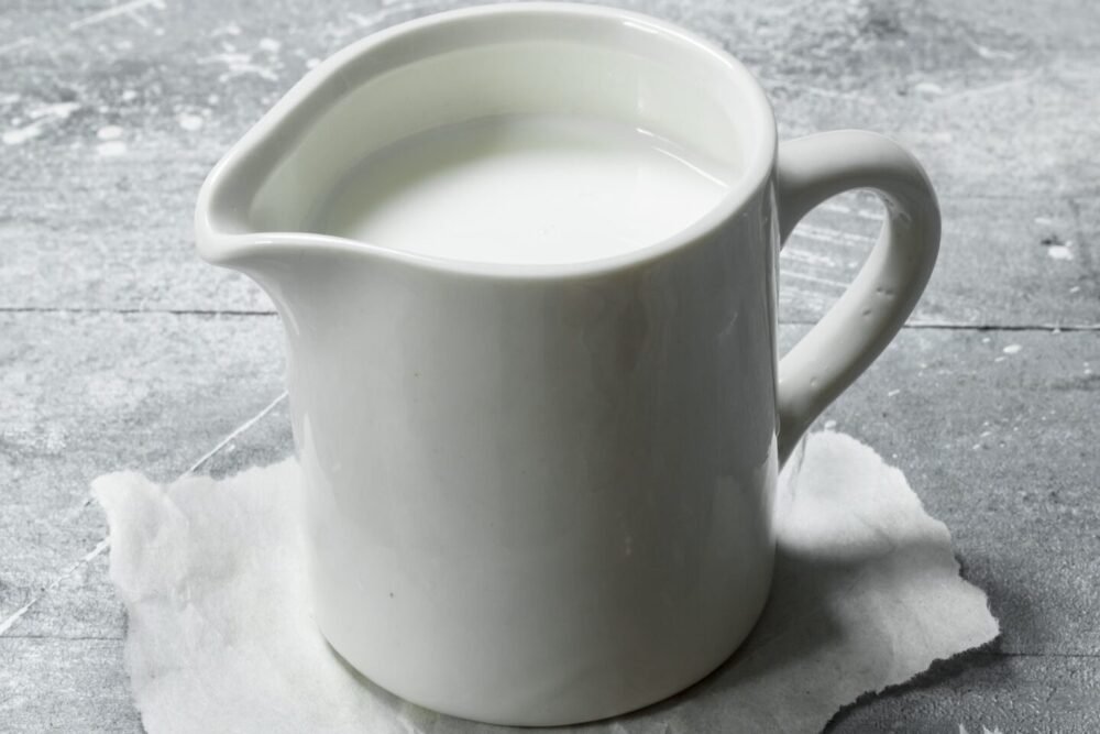 Milk in a cup on paper.